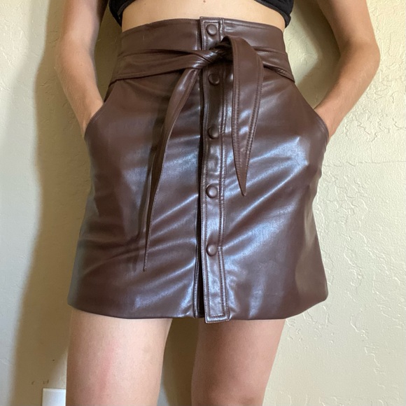 Urban Outfitters Dresses & Skirts - Brown faux leather urban outfitters skirt with a tie in the front, size S